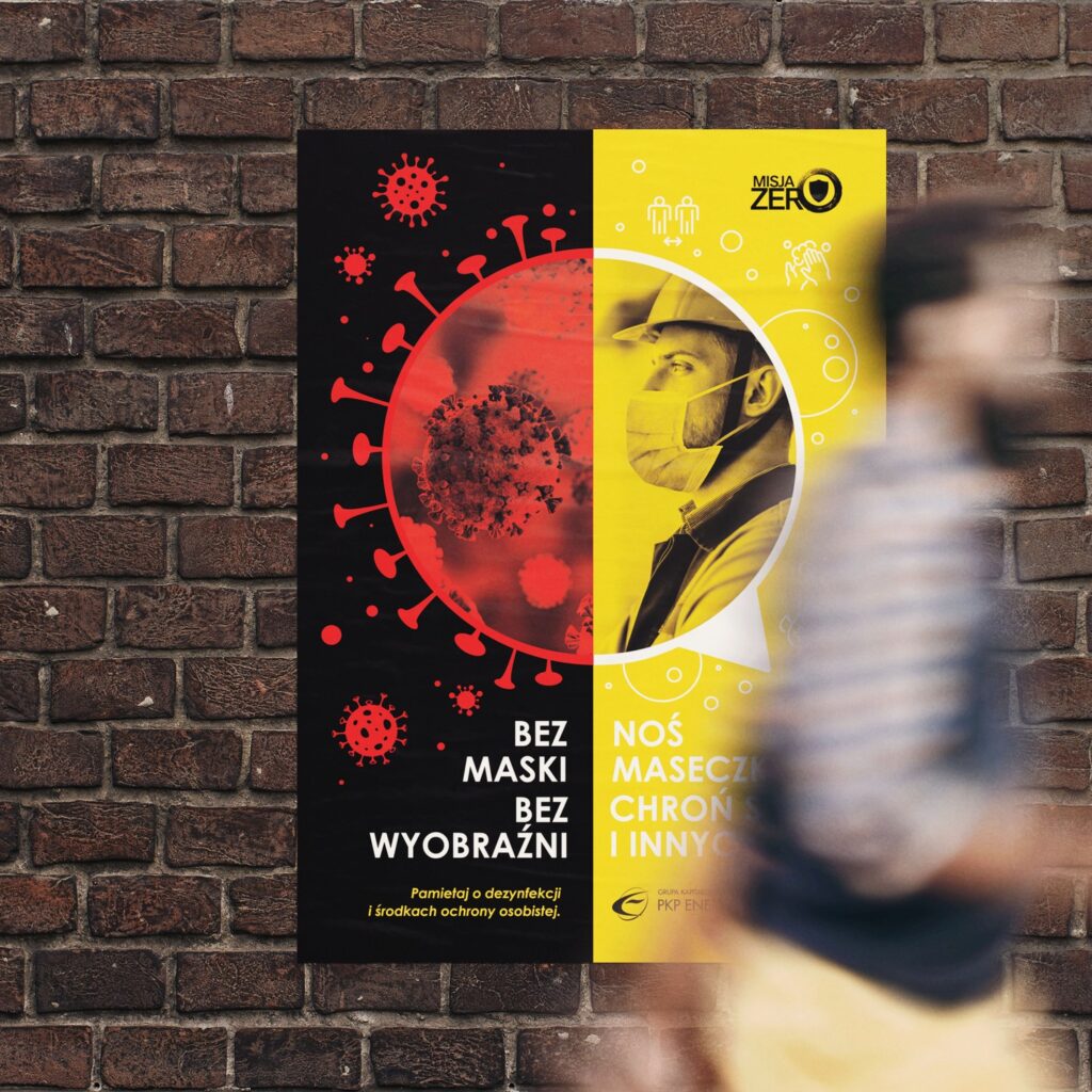 Bold red, black and yellow safety-awareness poster on a city wall — Misja Zero campaign design by Creative Lab.